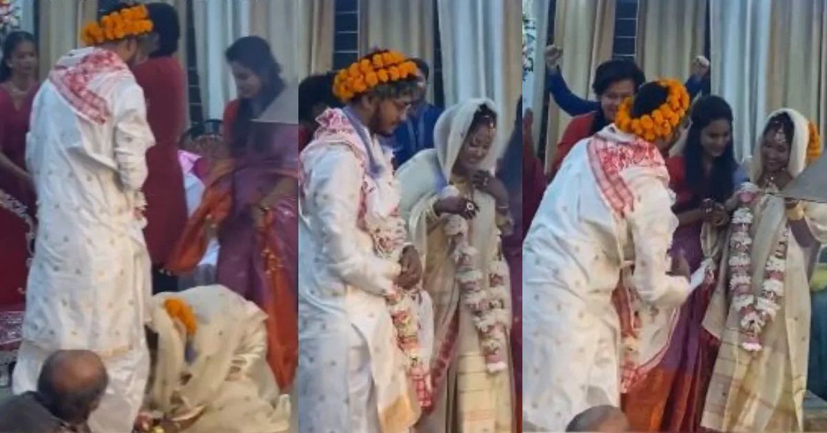 guwahati groom touches bride feet in wedding